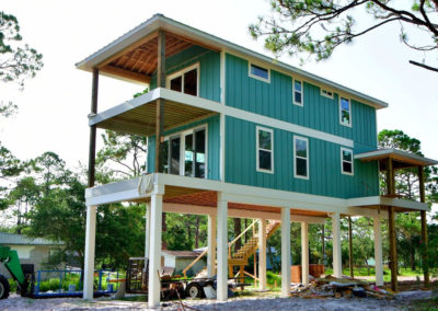 2 story SIP Panel home elevated on stilts at the beach.