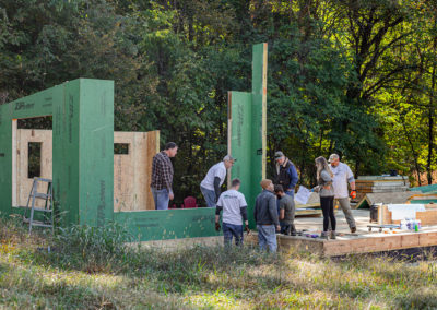 Building panels on a mono-slope roof home