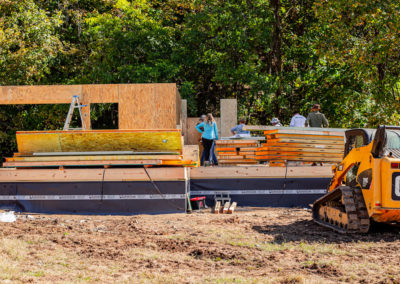 Eco-Panels stacked on subfloor as they are being set.