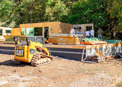 Skid-steer at SIP panels job site.