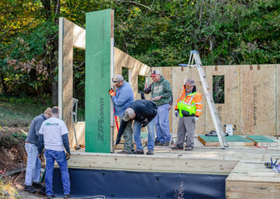 Building crew setting Eco-Panels patented corner piece at job site.